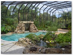 Custom pool with waterfall in a Stoughton & Duran custom home.