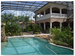 Custom pool enclosure in a Stoughton & Duran custom home.