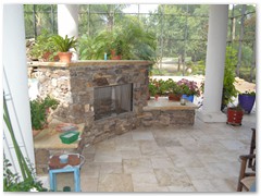 Outdoor fireplace in a Stoughton & Duran custom home.