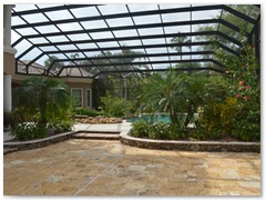 Two story screen enclosure in a Stoughton & Duran custom home.